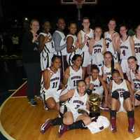 <p>Ossining holds up three fingers after winning its third consecutive Section 1 Class AA Girls basketball title. The Pride beat Our Lady of Lourdes, 83-51 Sunday.</p>