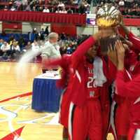 <p>The Peekskill High School girls basketball team hoists the gold ball after their win in the Section 1 Class A championship game.</p>