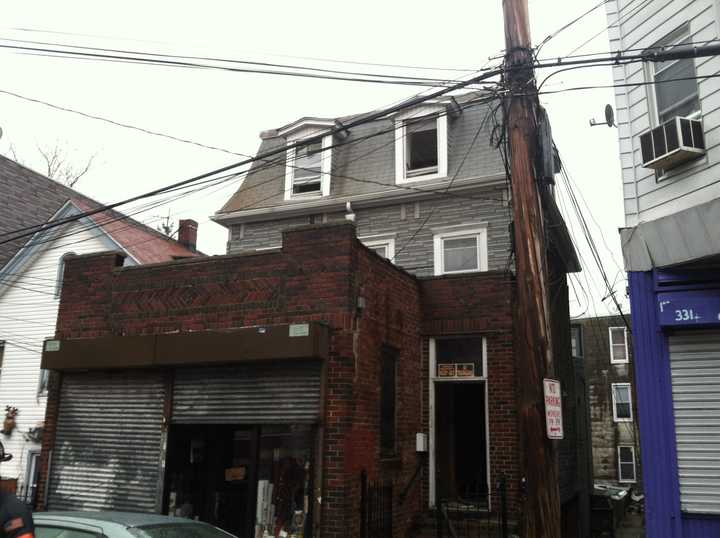 A man was hospitalized after trying to rescue cats from a burning building at 329 Walnut St., in Yonkers Tuesday. 