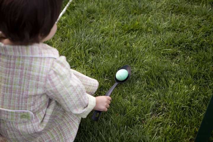 A young girl gets ready to roll her egg at the annual Easter Egg Roll on the South Lawn of the White House, April 5, 2010.