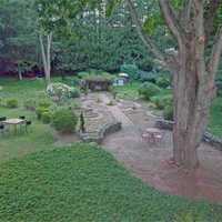 <p>The home at 79 Coleytown Road in Westport has an English garden, meadows and 100 feet frontage on the Aspetuck River.</p>