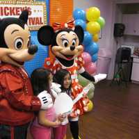 <p>After making paper air guitars, kids meet Mickey and Minnie and get their pictures taken.</p>