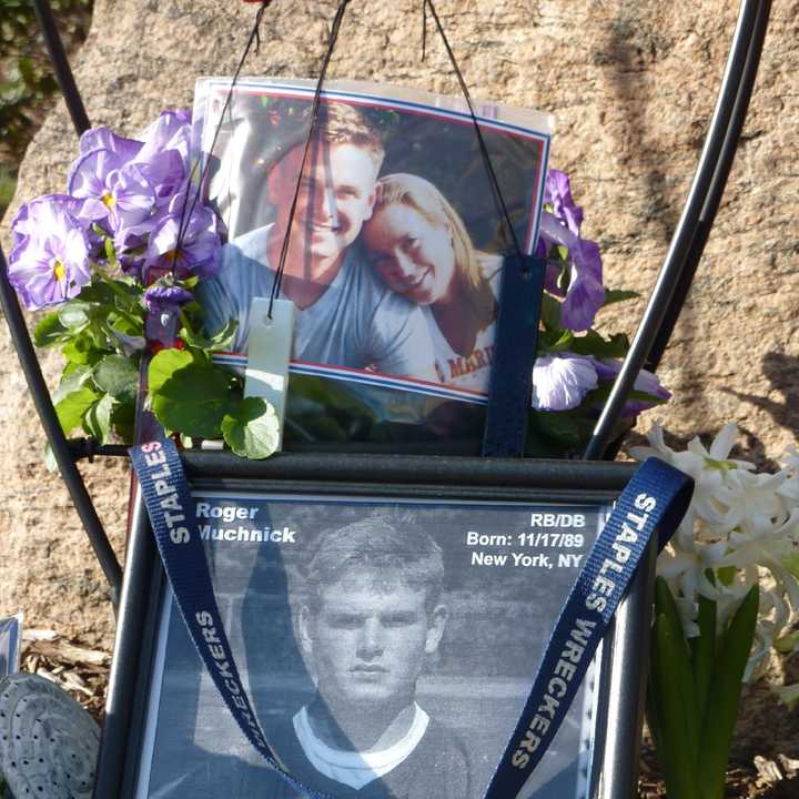 Photos of Marine Lance Cpl. Roger Muchnick, a 2008 graduate of Westport&#x27;s Staples High School, are included in a memorial constructed in his honor on Veterans Green.