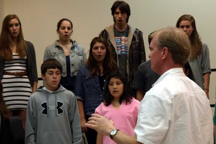 Fairfield County Children&#x27;s Choir music director Jon Noyes leads a rehearsal with his students. 