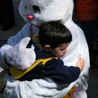 <p>The Easter Bunny has a hug for one youngster at Hilltop Farms in Croton.</p>