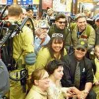 <p>Actor Dan Aykroyd, center with sunglasses and hat, poses with a group of &quot;Ghostbusters&quot; fans at his appearance at Total Wine and More in Nowalk.</p>