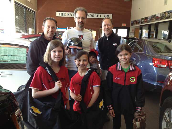 (From Left) Ingrid Weissman; Carolina Welch;  Leila Dann; (back) Jason Dolby, New Canaan Baseballs equipment manager; Tim Dann with Jack Dann;  Steve Karl, Vice President of KARL Chevrolet.