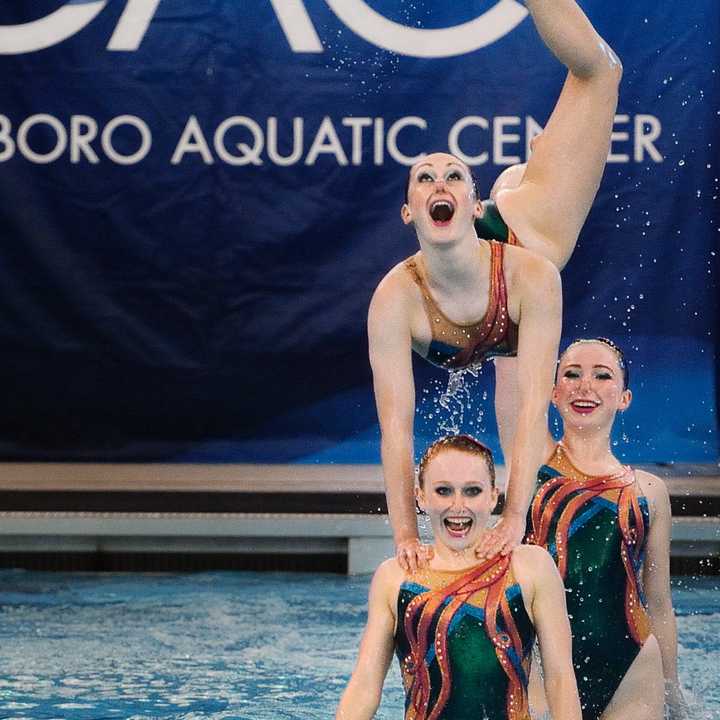 New Canaan YMCA Aquianas swimmers Renee Collett (top) Isabella Montgomery (front) and Emily Roney compete in Greensboro, N.C.