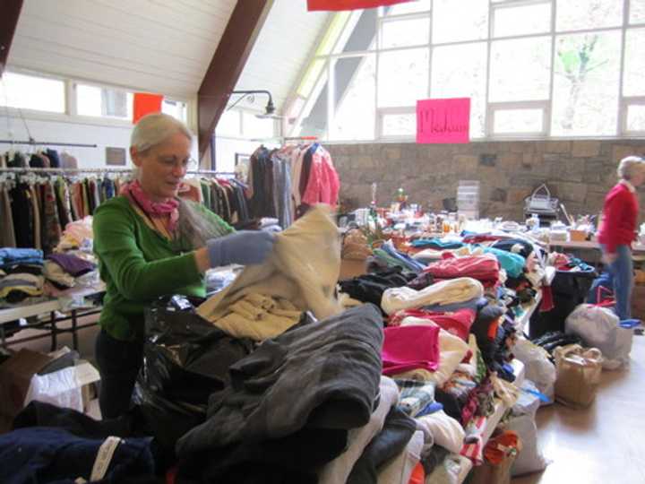 Londa Wilson helps set up Briarcliff Congregational Church&#x27;s Rummage Sale last year. The 101st annual sale begins Saturday morning.