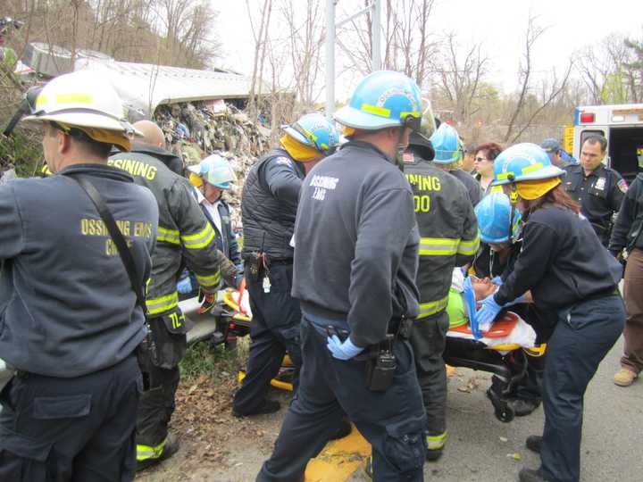 A Municipal Waste truck driver was conscious and breathing when he was pulled out of his oveturned truck on Route 9 on Tuesday.