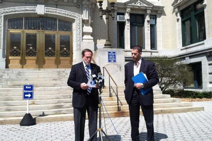 Former Yonkers Mayor Philip Amicone reads from a letter of apology as Sam Zherka looks on outside City Hall in one of the city&#x27;s top stories this week. 