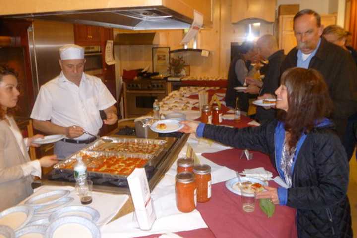 Lauren Teton samples a plate from DiNardo&#x27;s at last year&#x27;s A Taste of Pound Ridge.