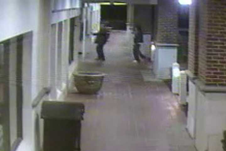 One of the suspects forces an employee to open Fairfield&#x27;s Lenox Jewelers during a robbery in April 2013.