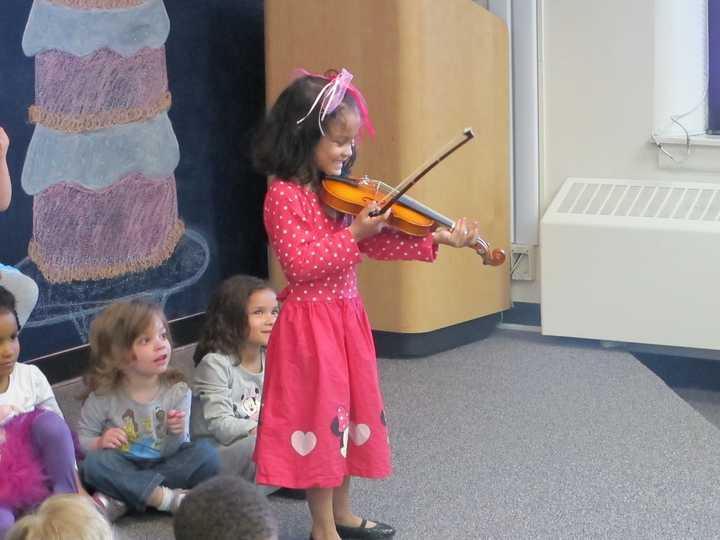 An ANDRUS student shows what she learned this year to parents in Tuckahoe.