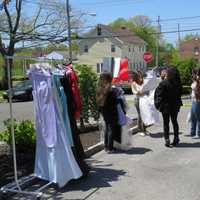 <p>Excited shoppers perused what was left of the dresses in Eastchester after less than an hour.</p>