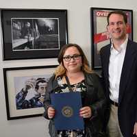 <p>Fairfield Warde student Shannon Magnaldi poses with U.S. Rep. Jim Himes and her award-winning photo, &quot;Off-Peak.&quot;</p>