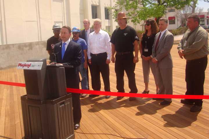 County Executive Rob Astorino, along with members of Titan Construction and other county officials, celebrate the opening of the boardwalk at Rye Playland.