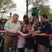 <p>County Executive Rob Astorino and county legislator Bill Ryan (left) help cut the ribbon on Rye Playland Saturday. </p>