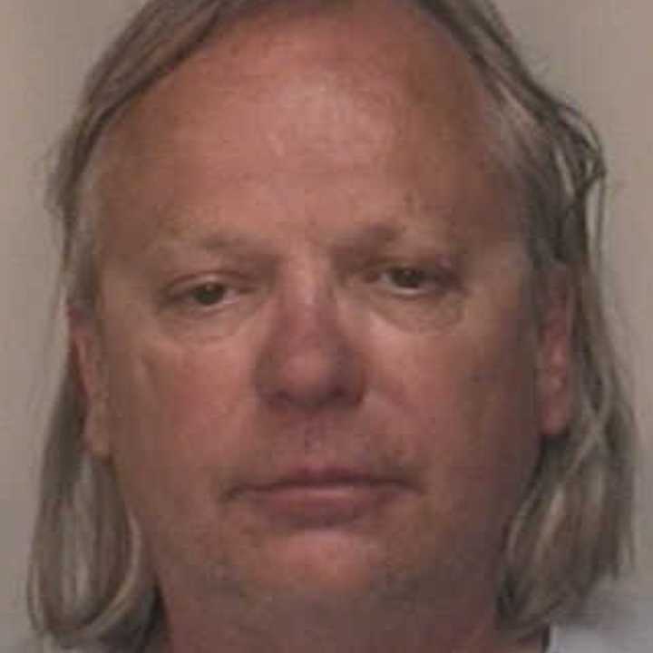 Kurt Justinius, 54, of Fairfield was charged with being a fugitive from justice by police Friday.