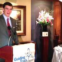 <p>Kate Katulak, a Guiding Eyes graduate, listens on as Eli Manning talks about the Yorktown Heights organization&#x27;s annual golf classic.</p>