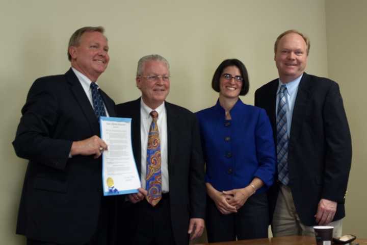 From left: Roger Ludlowe Middle School Principal Glenn Mackno accepts a proclamation from Fairfield Selectmen Michael Tetreau, Cristin McCarthy Vahey and Kevin Kiley.