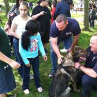 <p>Yonkers students take turns petting Mickey the police dog Thursday during a picnic inside Kingsland Point Park.</p>