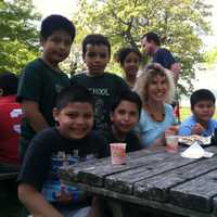<p>Yonkers teacher Joi Musikar and her students enjoy lunch inside Kingsland Point Park Thursday during the annual picnic sponsored by members of the Yonkers police unions. </p>