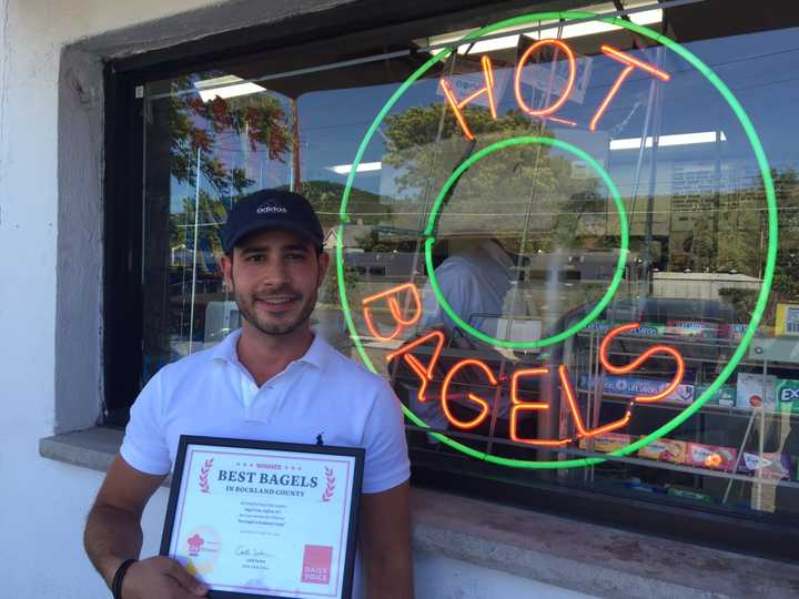 Nick Batistatos, owner of Bagel Train in Suffern, accepts the DVlicious award for Best Bagels in Rockland County.