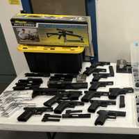 <p>Police say they seized dozens of firearms and partially-assembled &quot;ghost guns&quot; while raiding the Bensalem home and Bristol business of 32-year-old Russell Norton.</p>