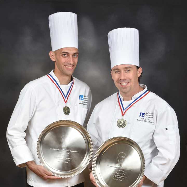 Jason Nyman, Manager of Food &amp; Nutrition of Patient Services (left), and John Graziano, Manager, Executive Chef, (right) with Silver Plate awards for their winning dish at the 2016 Association for Healthcare Foodservice Culinary Competition.