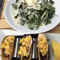 <p>Kale salad with fish tacos.</p>