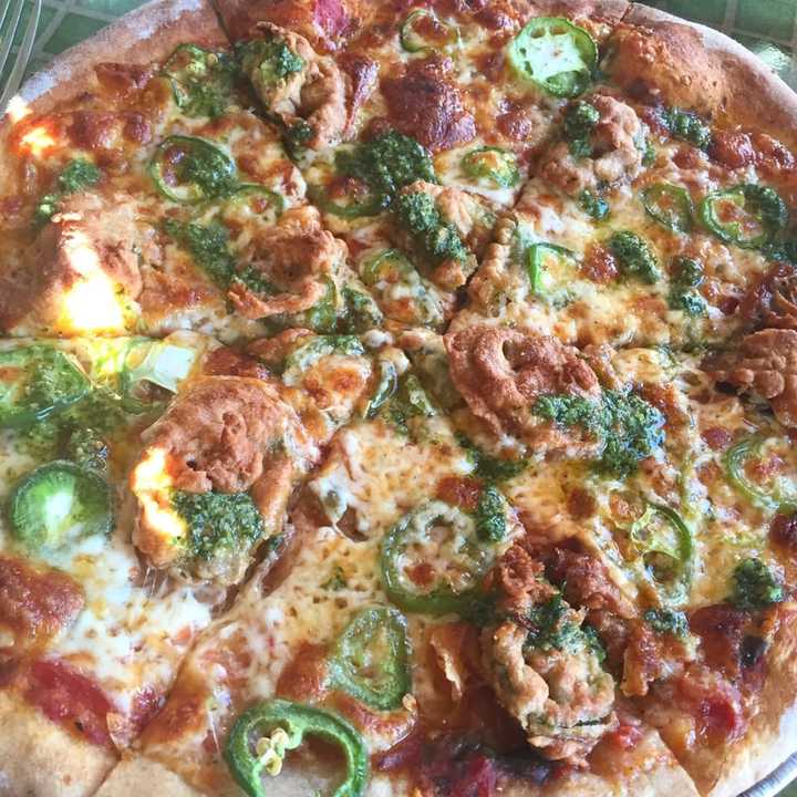 &quot;Holy Jalapeño&quot; pizza (Spicy Tomato Sauce, Cheddar Cheese, Cilantro Pesto, Raw &amp; House-made Beer Battered Fried Jalapeño Rings) from Benji &amp; Jakes (5 Horseshoe Lake Road in Kauneonga Lake)