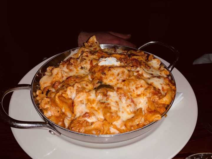 Pan-baked spicy veal sausage lasagna with crumbled veal, cherry peppers, tomato cream sauce, ricotta, Mafalda and mozzarella from Butera&#x27;s Restaurant, located at 65 East Main Street in Smithfield