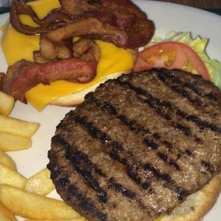 Burgers at the Hearth in Clifton are charbroiled the same way since 1968.