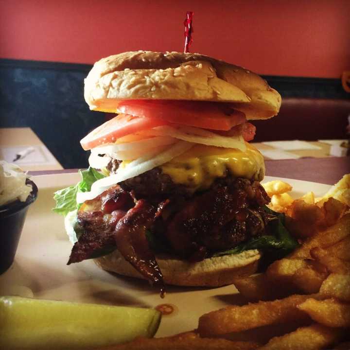 The Monster Burger (bacon and cheese between two burgers topped with cheese, lettuce, tomato and onion) from Frankie&#x27;s Waffles and Burgers, located at 565 Route 6 in Mahopac