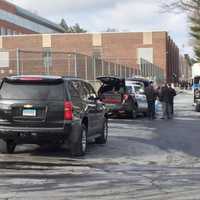 <p>Stamford police cars and personnel fill the area around Stamford High School after a bomb threat Tuesday.</p>