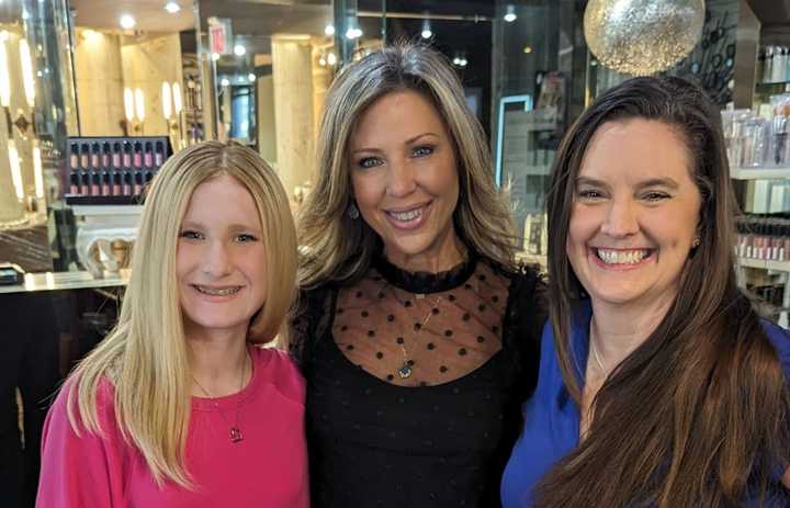 Middle schooler Bella, who lost her hair due to alopecia, with mom Jennifer Davis and Oakton High School teacher Erica Hosken.