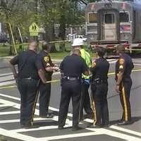 <p>City police confer with NJ Transit worker.</p>