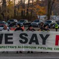 <p>Three men in a canoe were helped from the water Saturday during a protest against Spectra&#x27;s Algonquin pipeline expansion.</p>