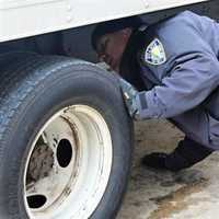 <p>PAPD CVI Francis Franco inspecting a commercial vehicle.</p>