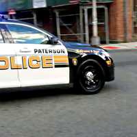 Paterson Police Seize Stolen Assault Rifle, Semi Handgun, Bust 2 In Holdup