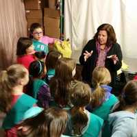 <p>People for People executive director Diane Serratore talks to Girl Scouts at the food bank in Nanuet.</p>