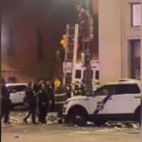 Triumphant Phillies Fan Climbs Street Pole, Gets Stuck (VIDEO)