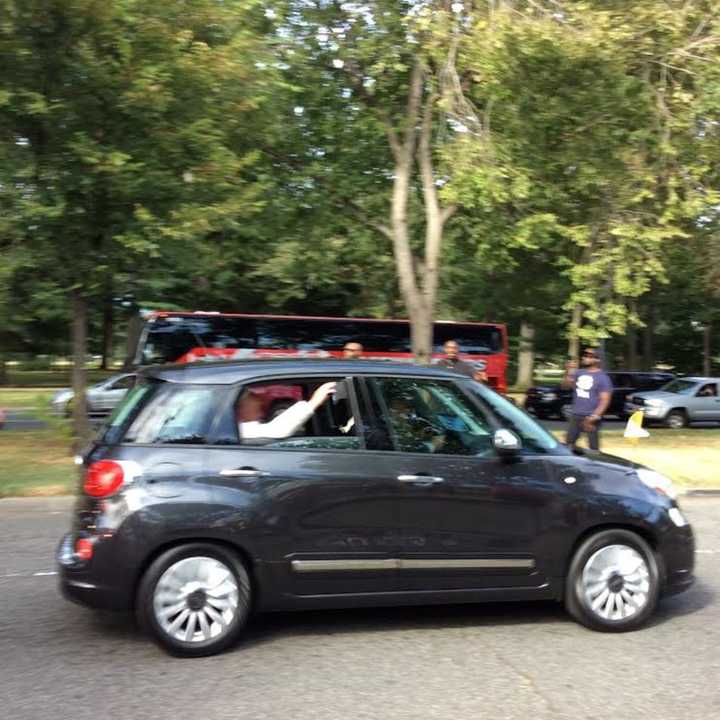 Pope Francis waves from his Fiat as he heads for Andrews Air Force Base on Thursday afternoon. His motorcade went down Independence Avenue, right past the memorial for Martin Luther King Jr. 