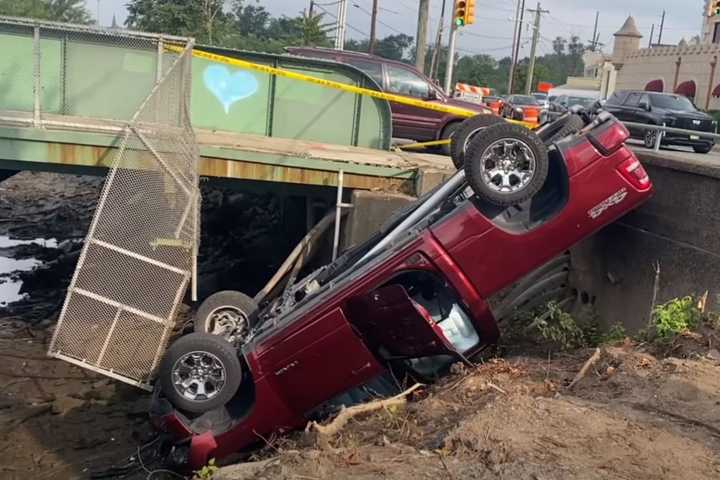 Pickup Crashes On Banks Of Passaic River