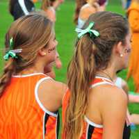 <p>Girls on the Ridgefield High School cross country team watch at Tuesday&#x27;s meet.</p>