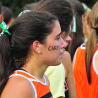 <p>A Ridgefield girl fights back tears during an emotional race on Tuesday. </p>