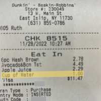 <p>Jennifer Marie&#x27;s receipt showing the $1 dollar charge for a cup of water at the East Islip Dunkin&#x27; Donuts on Main Street Monday, Nov. 28.</p>