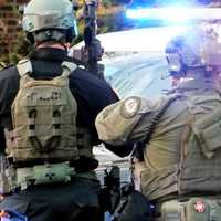 SWAT STANDOFF: Stabbing Suspect Sets Fire, Tosses Furniture Out Window, Seized After Struggle