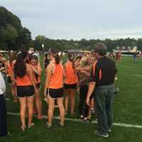 <p>Girls on the Ridgefield High School cross country team comfort each other after Tuesday&#x27;s race in Trumbull. </p>